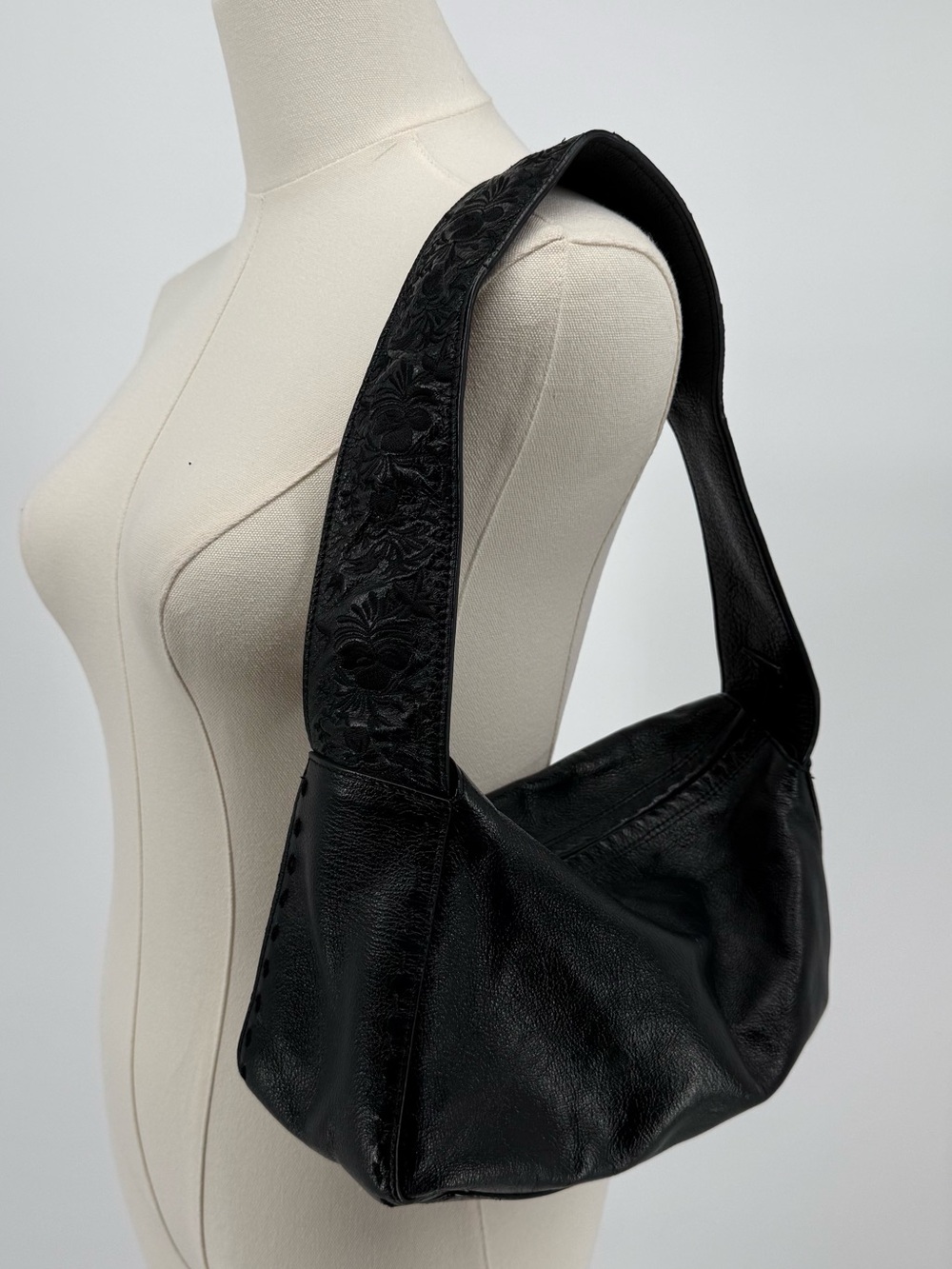 Express Black Leather Shoulder Bag with Embossed Floral Strap